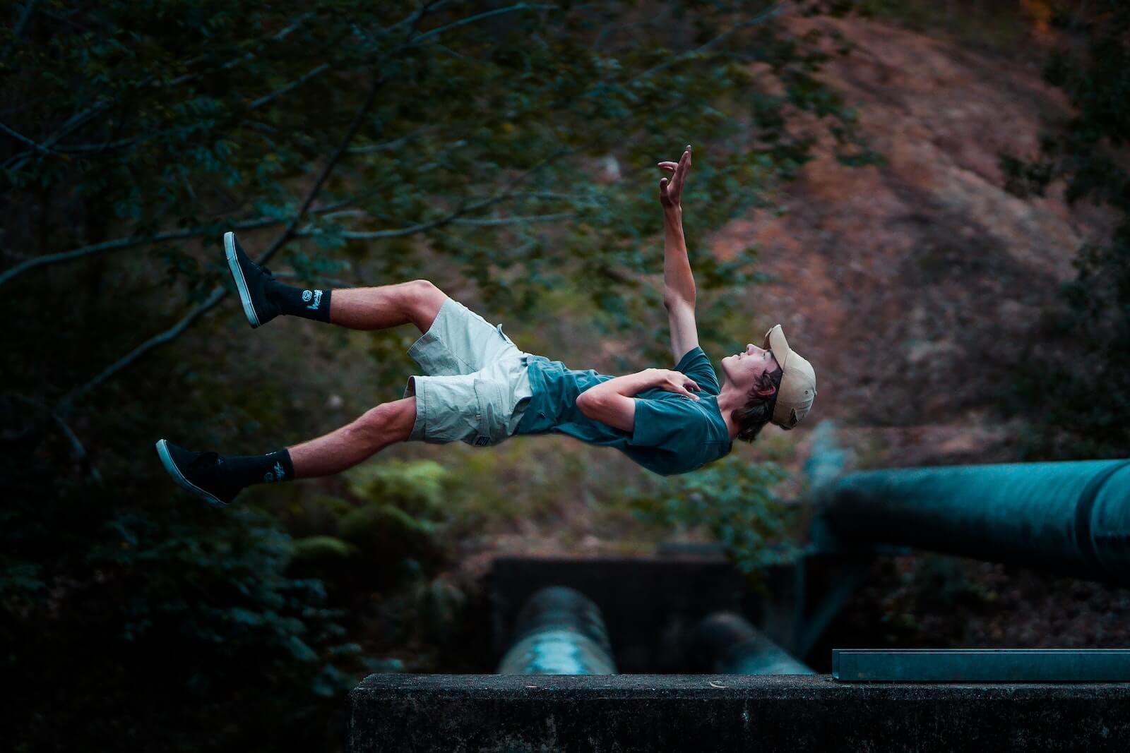 2463079 Man Wearing Green T-shirt and White Shorts floating in an Out of Body Experience