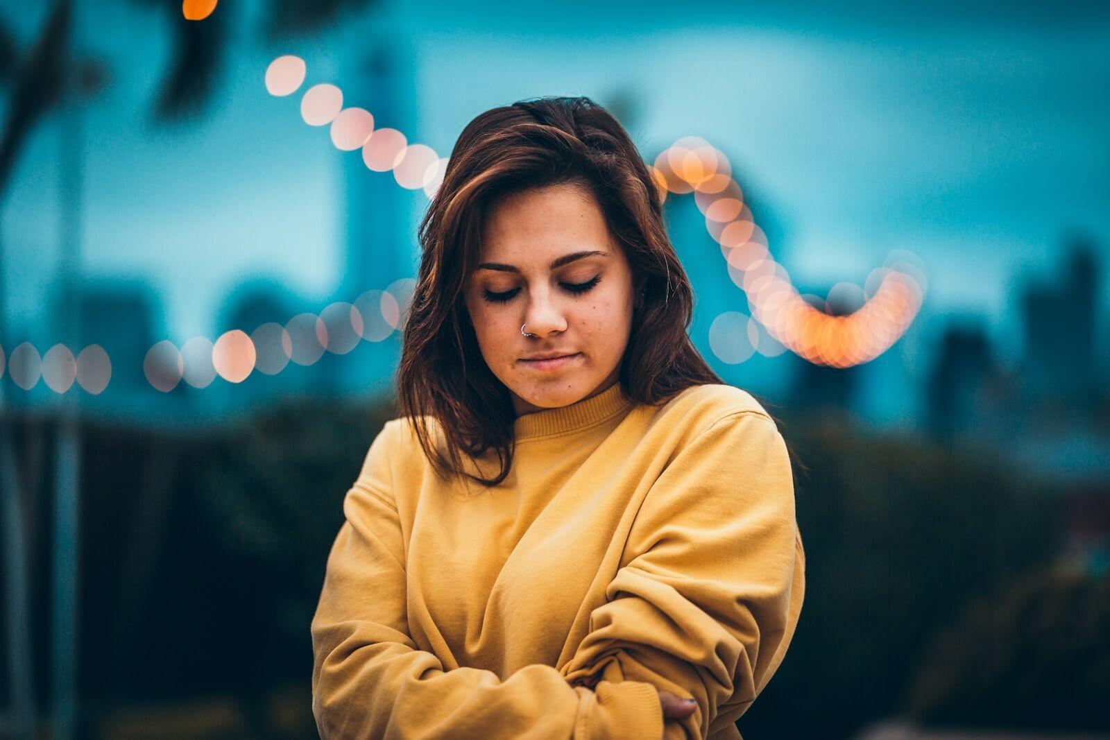 bokeh portrait photography of woman wearing sweatshirt and with the look feeling guilty with no boundaries